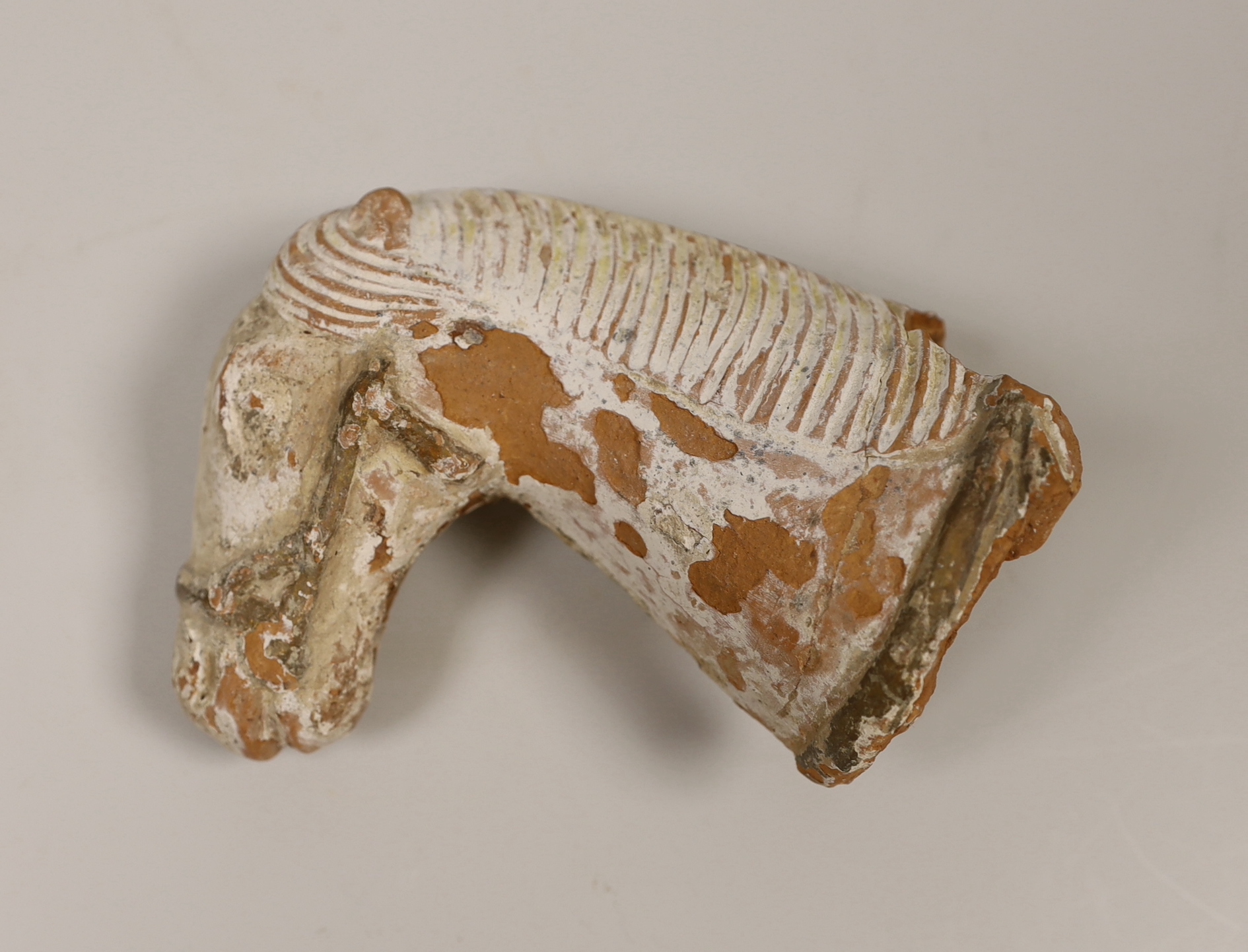 Chinese terracotta horse head, possibly Tang dynasty and two Chinese blue and white bowls decorated with elders, the largest 12cm high